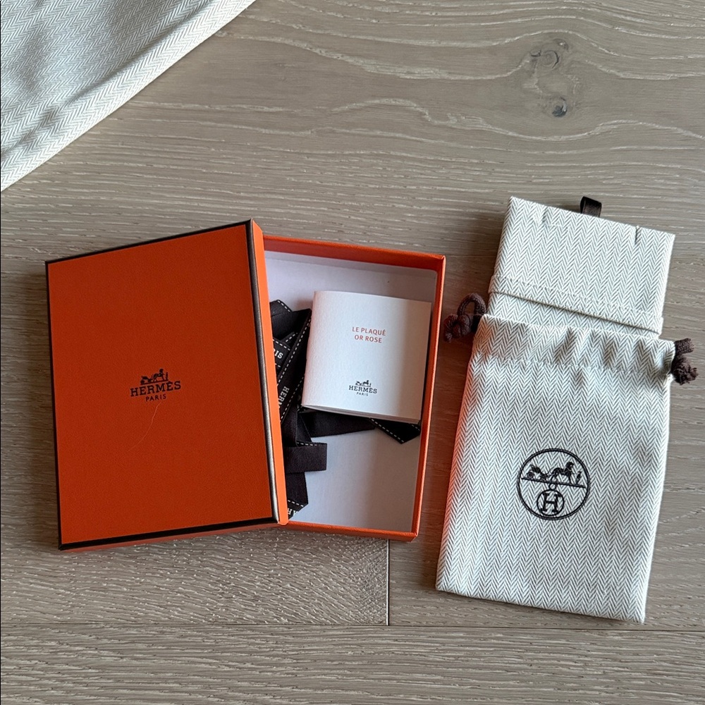 Hermès Orange Box with Black Ribbon and Cream Bag